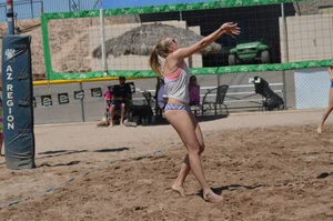 Beach volleyball blonde looking sexy and showing her body off