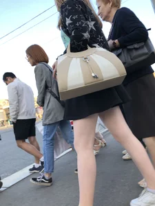 Candid girl wearing a short skirt crossing the street, awesome pale legs
