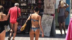 Sexy bikini babe touches her own pussy in thong