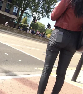 Chav brunette with a nice ass and vpl in tight black leather pants