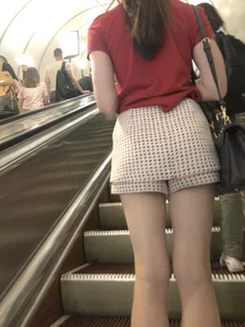 Amazing Long And Slim Legs of a Candid Girl Standing on the Subway Escalator