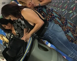 Thick brunette in tight jeans and showing some side boob