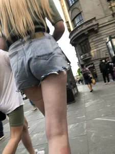 Street closeup of really hot legs and booty in fringed shorts