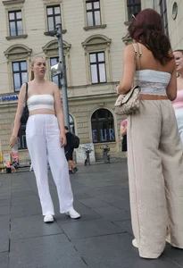 Long blonde braless in a white outfit (many pictures)