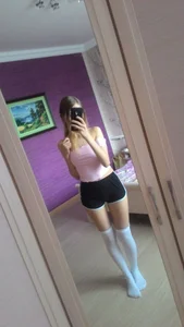 Cute Slim Girl in Shorts and White Knee Socks Mirror Selfie