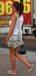 Girl in little floral shorts showing her cheeks