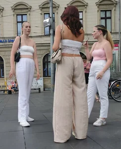 Long blonde braless in a white outfit (many pictures)