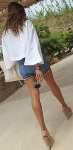 Flat ass leggy girl in denim shorts