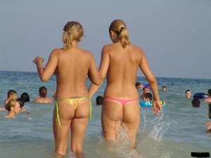 A bunch of sexy beach voyeur babes in bikinis, thongs and topless