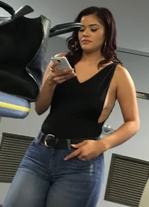 Thick brunette in tight jeans and showing some side boob