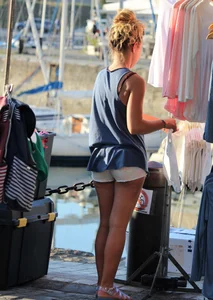 Sexy blonde girl in short white shorts