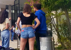 Chunky girl wearing a top and denim shorts