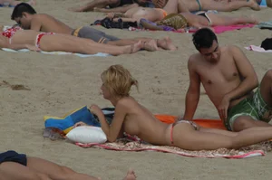 Topless girls on a beach in Barcelona