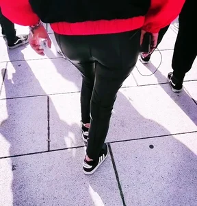 Ass in leather pants closeups on the street