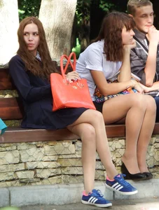 Girls in Dress and a Skirt Sitting on a Park Bench in Pantyhose Creepshot