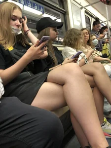 Hot Girls in a Subway Train Sitting With Crossed Legs Closeups And Flashing Booties Under Skirt