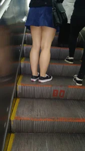 Stocky Legs on a Subway Escalator - Skirt and Sneakers