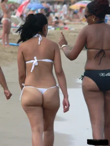 Bunch of sexy babes at the beach in thong bikinis
