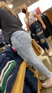 Two blonde teens shopping
