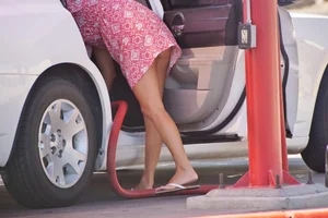 Sexy blonde upskirted in pink dress while cleaning her car