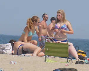 3 girls on the beach in bikinis with big boobs, one brunette and two blondes