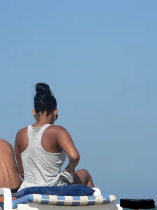 Hot ass topless beach girl with great tits lets her little brother oil up her ass in thong bikini