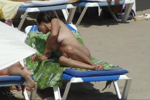 Girls on a nude beach in Sitges, Spain
