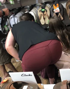 MILF in red leggings bends for the camera