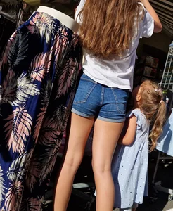 Hot Candid Milf in Shorts With Great Legs Shopping Clothes on the Street Market Creepshots Gallery