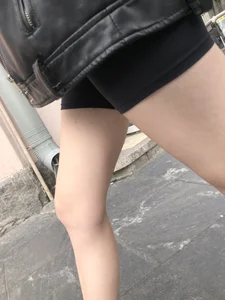 Very hot legs of a candid girl wearing a leather jacket