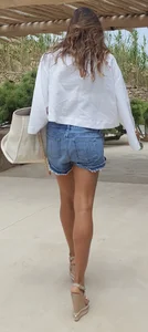Flat ass leggy girl in denim shorts