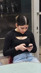 Hot latina in tight jeans at the laundromat