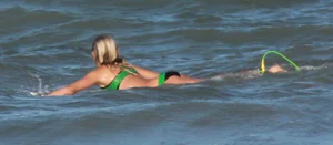 Hot surfer chicks out in the water