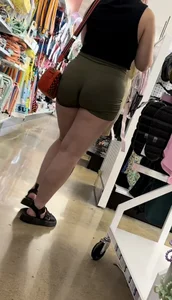 Juicy brunette in green spandex shorts OC