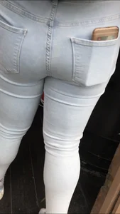 Fat ass in light jeans