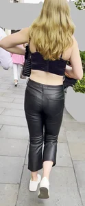 Sexy blonde in tight shiny jeans and croptop