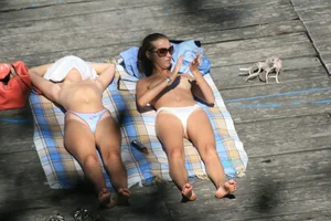 Two teens stripping and going topless to tan