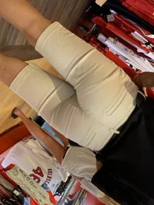 Bunch of girls in various outfits at a Cardinals baseball game