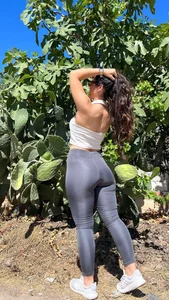 Stocky non-candid girl wearing leggings, photos in a garden