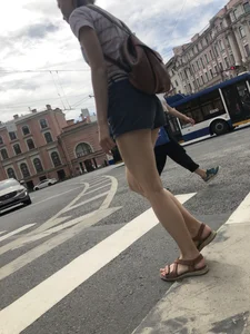 Young Girl in Shorts And Sandals Crossing the Street Gallery