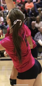 Teen girls playing volleyball