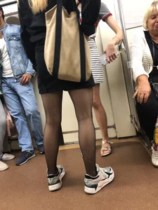 Nice candid legs in black pantyhose in a subway train