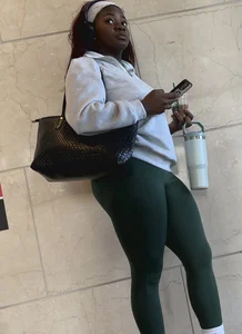 Ebony with a DEEP WEDGIE  in Green Leggings