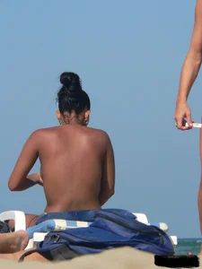 Hot ass topless beach girl with great tits lets her little brother oil up her ass in thong bikini