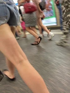 Girl with Hot Muscular Legs in Shorts - Subway Creephot