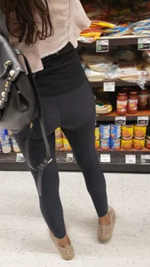 Cute butt in shiny black leggings