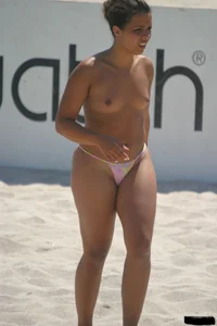 A bunch of sexy beach voyeur babes in bikinis, thongs and topless
