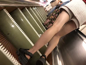 Amazing Long And Slim Legs of a Candid Girl Standing on the Subway Escalator