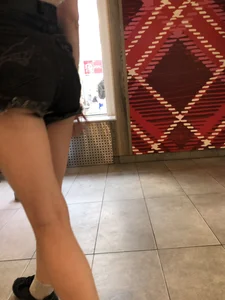 Cute Teen Girl in Mini-Shorts Walking into a Cafe Legs And Booty Closeups