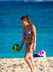 A few sexy girls with great asses in thong bikinis at the beach
